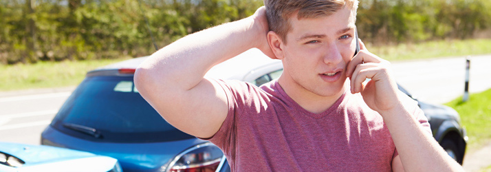 Chiropractic Kennewick WA Auto Accident Young Man On Phone Chiropractic Kennewick WA Auto Accident Young Man On Phone